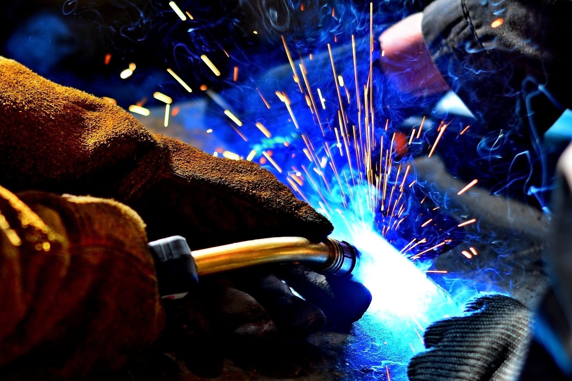 Industrial Worker labourer at the factory welding steel structure Industrial Worker labourer at the factory welding steel structure